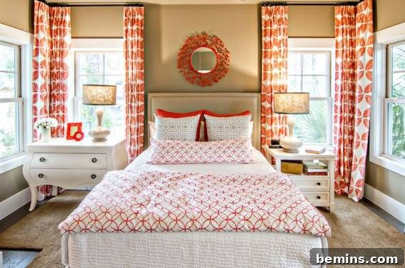 A spacious bedroom decorated with a harmonious blend of orange and white.