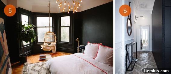 Bedroom with dark paneled walls