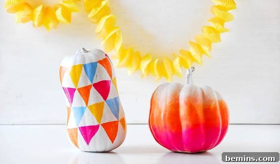 Two colorful mini pumpkins and a yellow decorative object in the background Funky ombre and geometric pumpkins DIY.