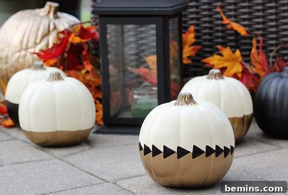 An assortment of pumpkins with artsy designs, and a Fall theme overall. Chic painted fall pumpkins project.