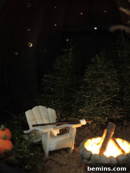 A white chair sits next to a lit fireplace.