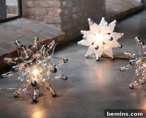 From Burned-Out to Brilliant: DIY Light Fixtures 3 Close-up view of light bulb ornaments resembling snowflakes, emitting a soft, ethereal glow on a dark surface.