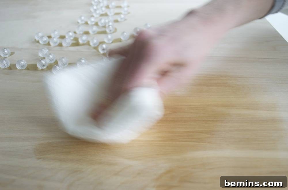 How to Design Your Own Dazzling Light-Up Sign 10 Applying Danish wood oil to the plywood to protect the wood and enhance its natural grain.