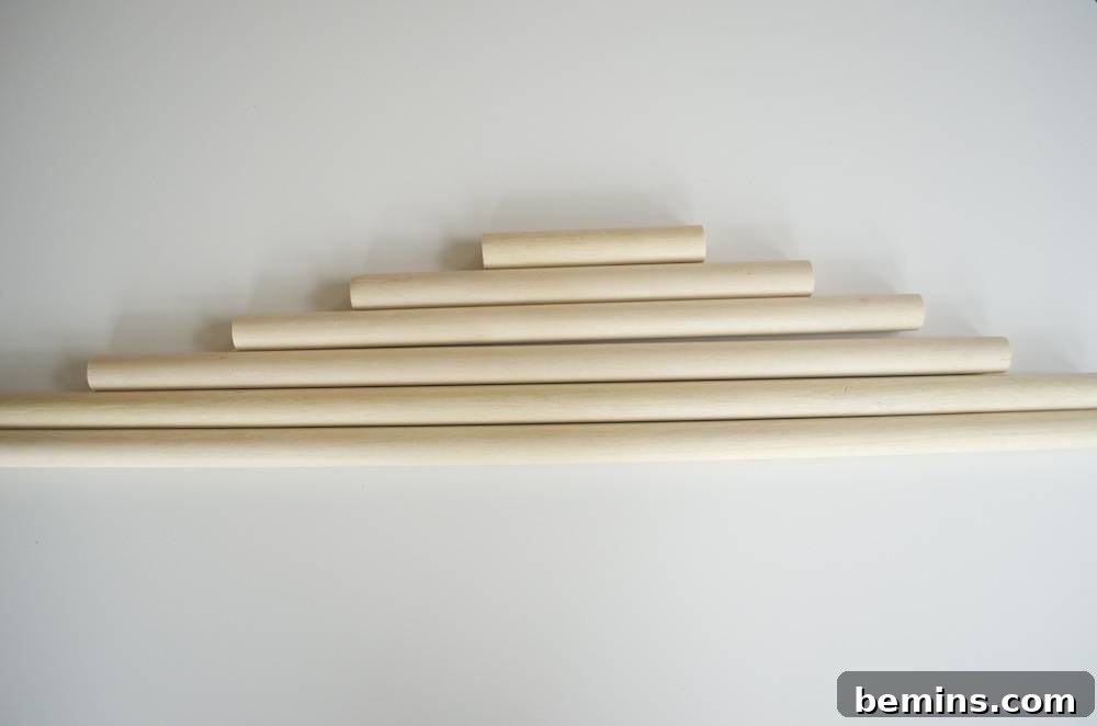 Wooden dowels arranged like a Christmas tree.