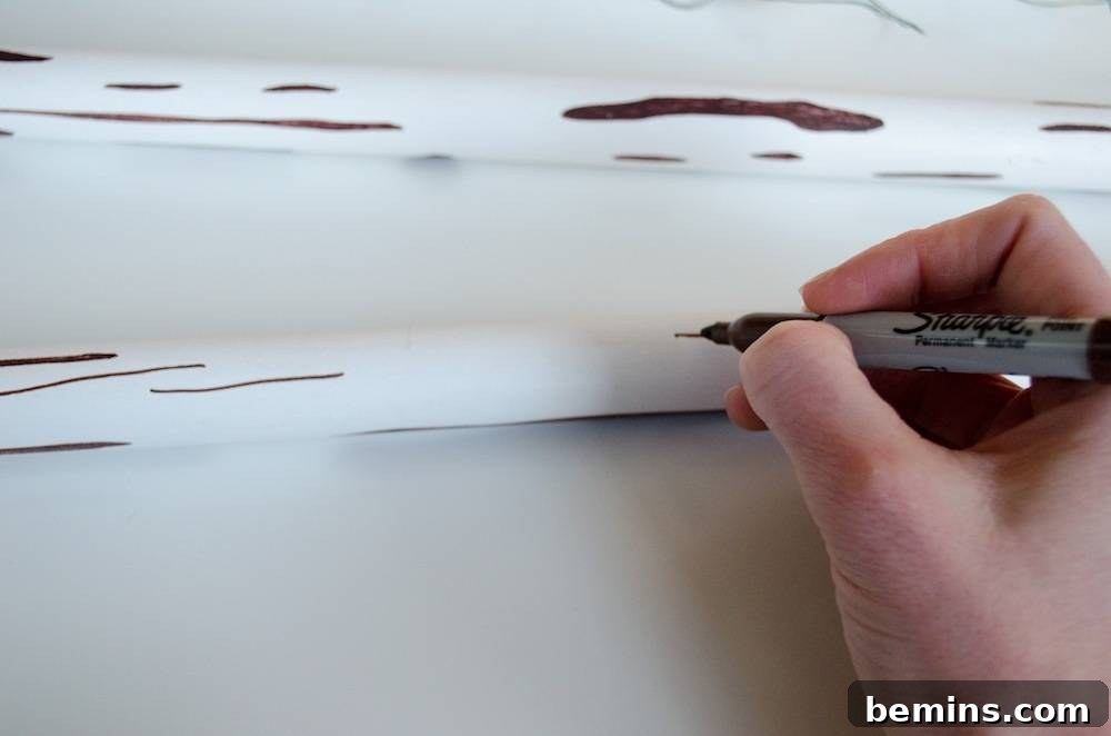 Two white tubes with brown lines drawn on them.