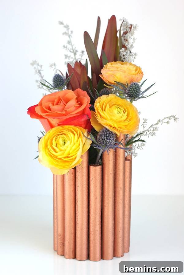 Golden Thanksgiving: 13 DIY Decor Ideas in Gold & Copper 13 Colorful roses beautifully displayed in a DIY faux copper pipe vase.