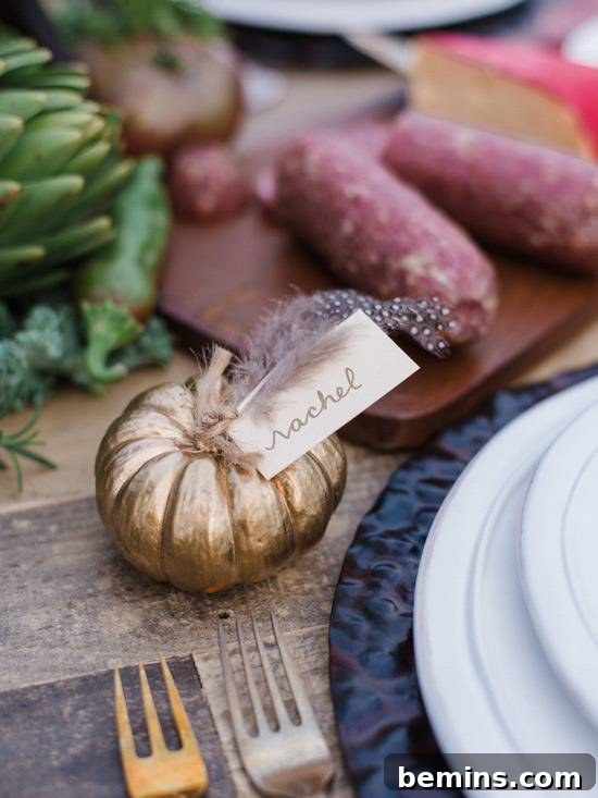 Golden Thanksgiving: 13 DIY Decor Ideas in Gold & Copper 8 Small gold pumpkin with a name label, used as a Thanksgiving placecard.