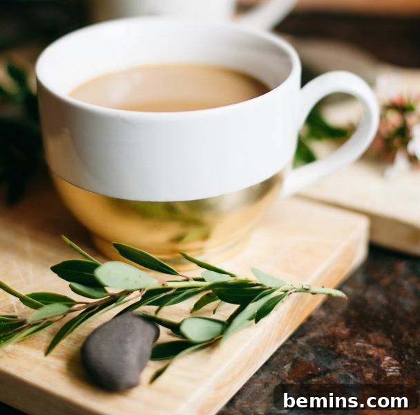 Golden Thanksgiving: 13 DIY Decor Ideas in Gold & Copper 10 White tea cup with a stylish gold base filled with tea.