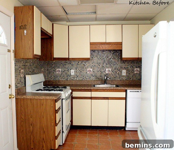 Appliances and cabinets line the walls of a kitchen, showcasing a refreshed space.