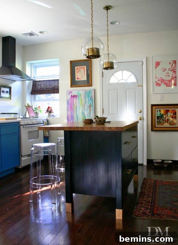 A black and brown kitchen island stands prominently in a well-designed kitchen.