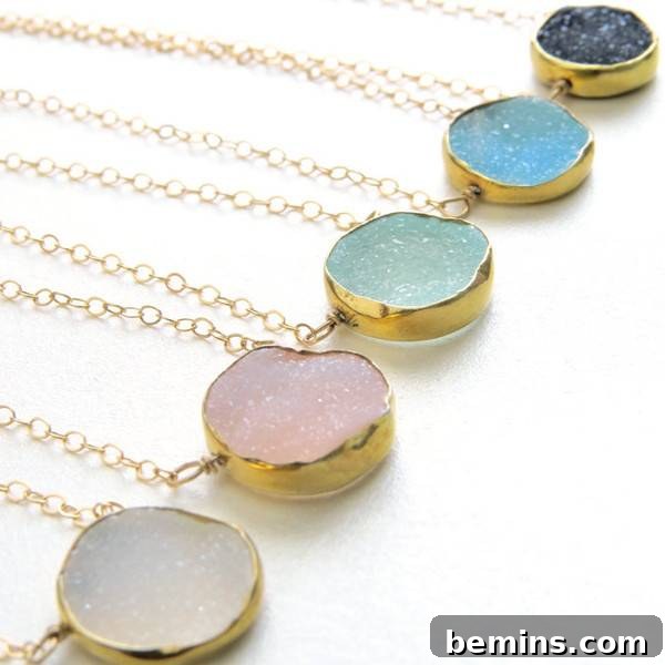 Five gold pendants with colored glass in round gold circles. Druzy necklace from Shop Something Blue.