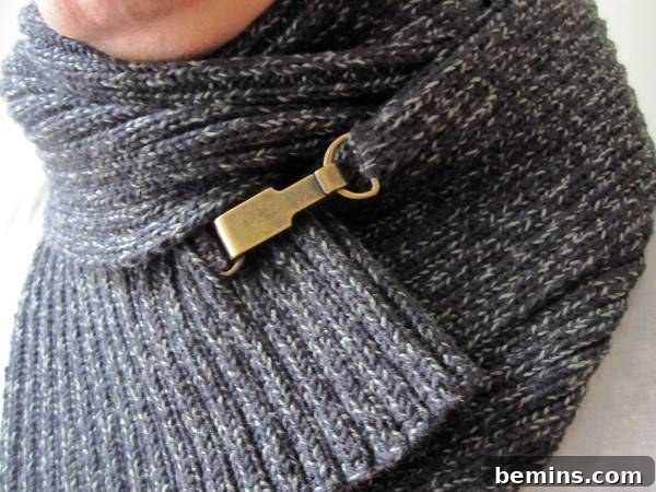 A scarf has a clasp on it. Merino Wool Scarf from LainDesign.