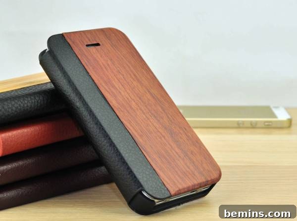 A planner cover has a wooden finish. Leather and Wood iPhone Flip Case from Good Wooden.