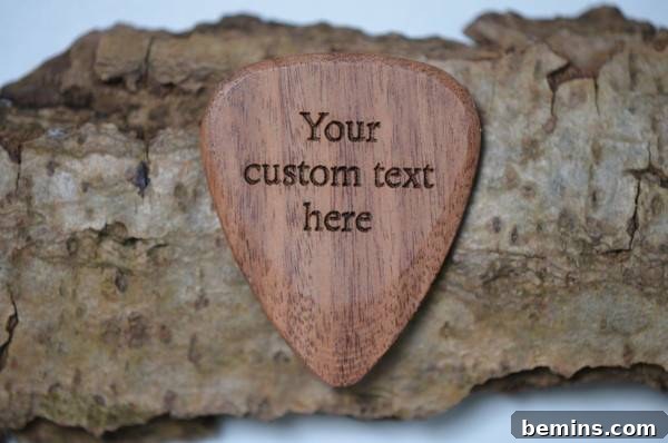 A handmade wooden heart. Custom Engraved Wooden Guitar Pick from Carve Code.