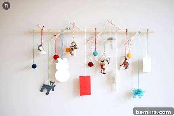 Colorful Xmas crafts hang from strings.