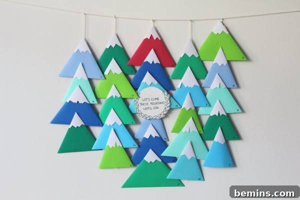 A banner is made of whitecap mountains in three shades of green and two shades of blue.