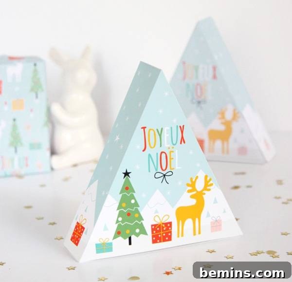 A triangular gift box painted with Christmas trees and reindeer.