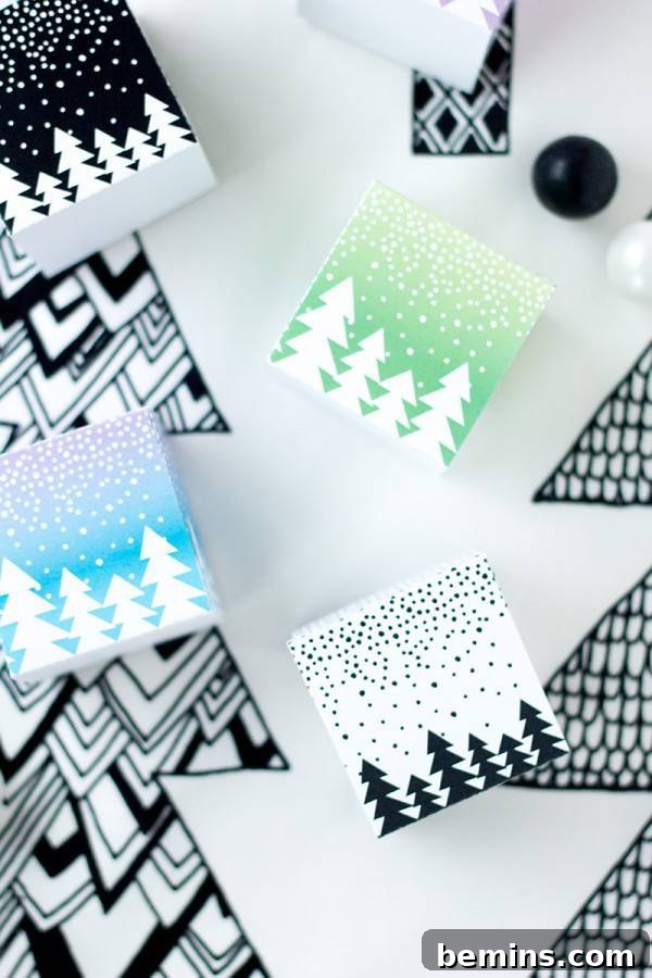 Several white pieces of paper with Christmas tree designs on them.