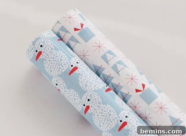 Two rolls of wrapping paper, stylized in a snowman, Christmas art design.