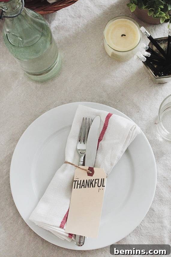 Quick & Easy Thanksgiving Table: 13 DIY Ideas Under an Hour 12 Thankful printable gift tags attached to flatware in a napkin on a plate.