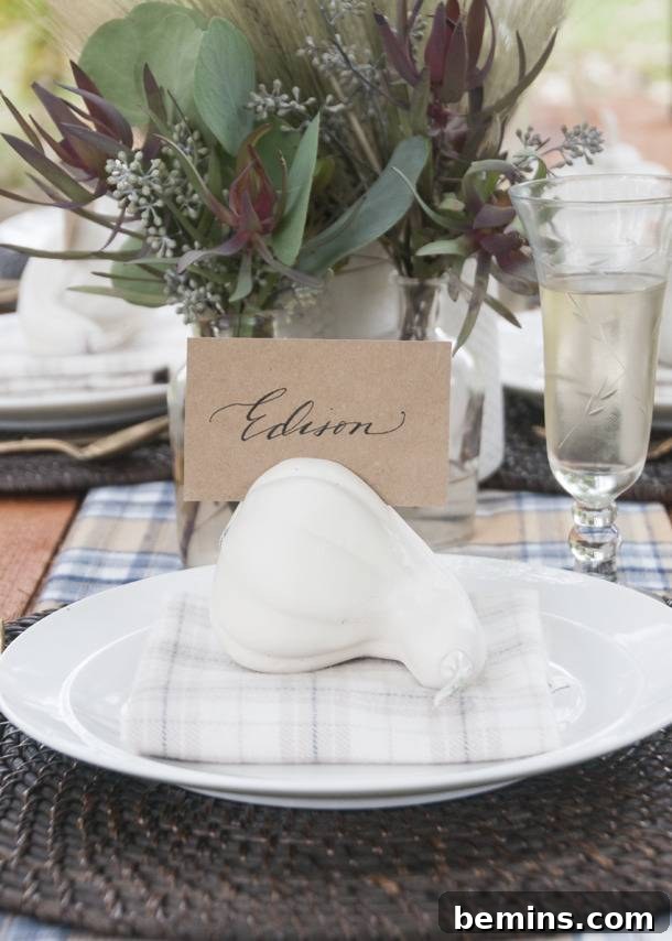 Quick & Easy Thanksgiving Table: 13 DIY Ideas Under an Hour 7 Thanksgiving place setting with a white gourd, succulents, and a plaid napkin.