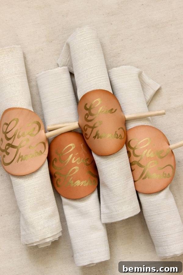Quick & Easy Thanksgiving Table: 13 DIY Ideas Under an Hour 9 Leather napkin rings DIY made from brown labels tied around white napkins.