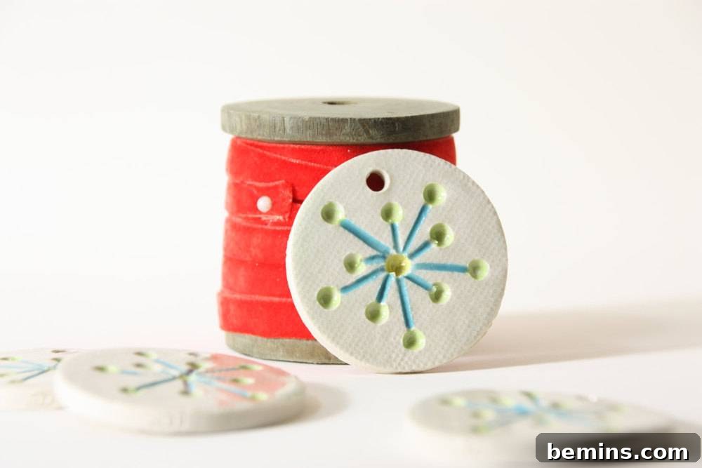 The Ultimate Ornament Roundup: 12 Must-Have Decorations for Your Tree 13 A sewing kit sitting on top of a white table.