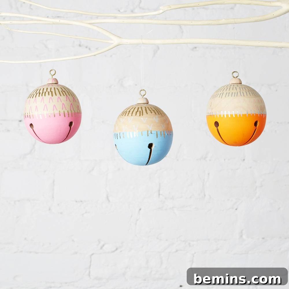 The Ultimate Ornament Roundup: 12 Must-Have Decorations for Your Tree 3 Three vibrant smiley face ornaments hanging.
