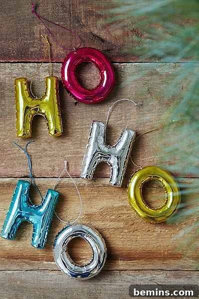The Ultimate Ornament Roundup: 12 Must-Have Decorations for Your Tree 4 Three ornaments spelling out "HO HO HO".