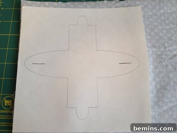 Disc shaped drawing on piece of paper on top of tissue paper.