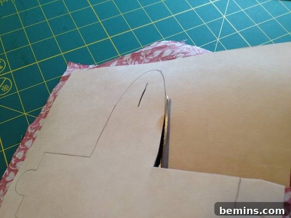 Cutting out cardboard for a fabric gift box.