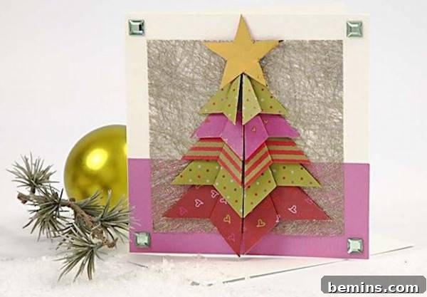 A homemade card has a crafted Christmas tree on it.