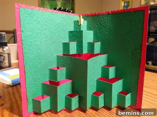A 3D card with ascending green block with red tops and a yellow star at the top.