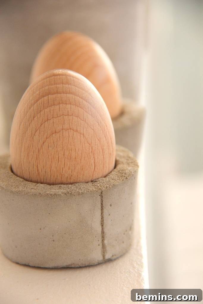 A concrete egg cup holding a soft-boiled egg