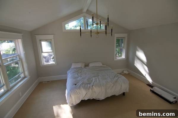 Before: A simple bedroom with white walls and minimal decor, ready for a stylish transformation