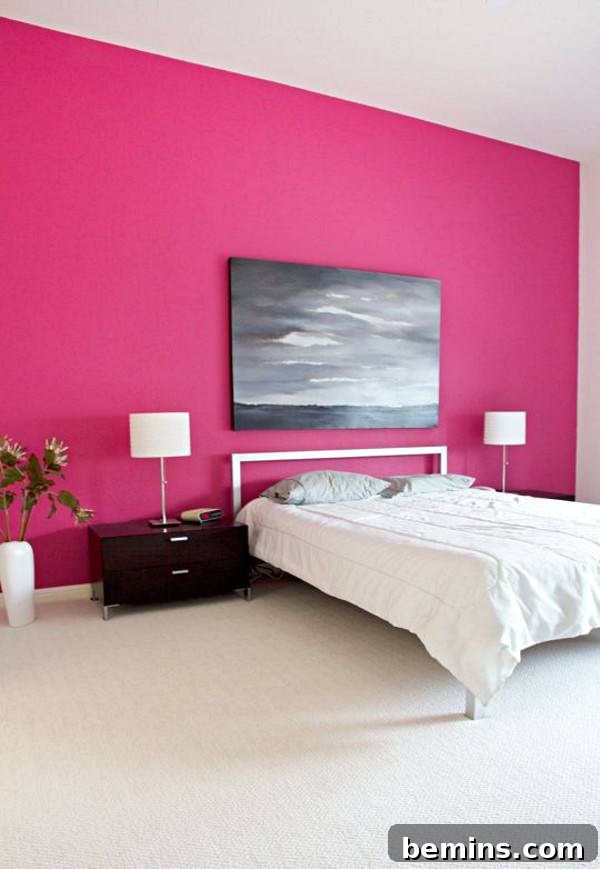 Pink Power: 16 Dreamy Bedrooms for the Bold at Heart 11 A white bed next to a pink wall.