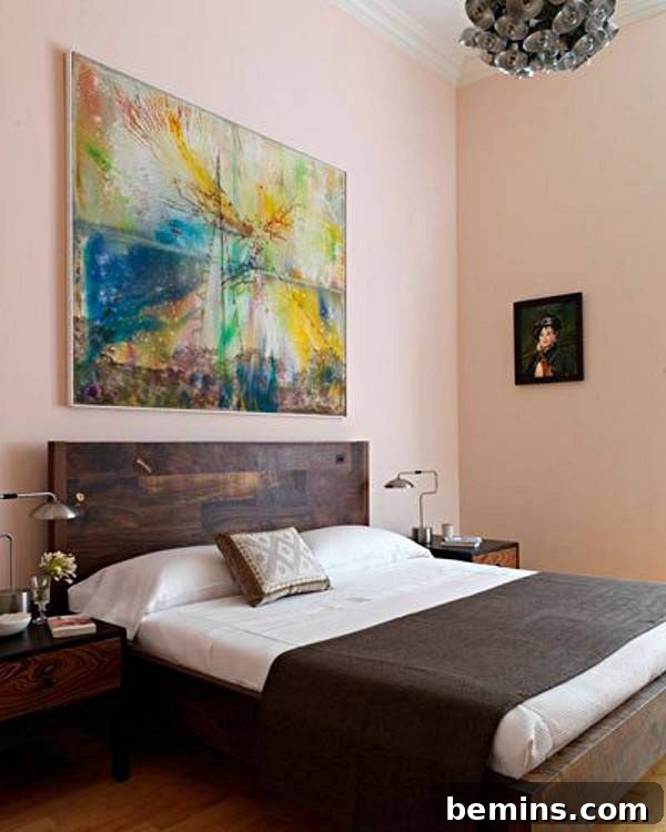Pink Power: 16 Dreamy Bedrooms for the Bold at Heart 13 Pink color bedroom with wall painting frame and wooden bed.