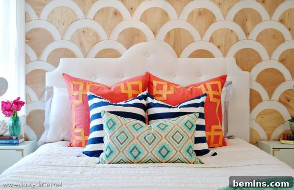 Unique DIY Headboard Designs to Reinvent Your Bedroom 21 Wood and white color combination headboard with designer pillows on bed.