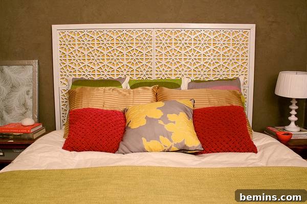 Unique DIY Headboard Designs to Reinvent Your Bedroom 23 Hexagon designed headboard of a bed with designer pillows.