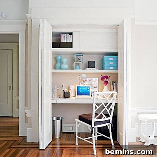 Small home office space with custom-built wooden shelves fitted into a converted closet, providing ample storage and a neat workspace.