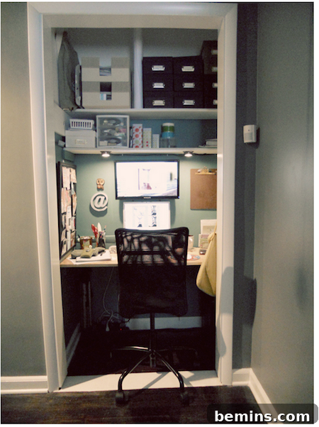 A coat closet in a hallway cleverly transformed into a small office with a built-in desk and shelving.