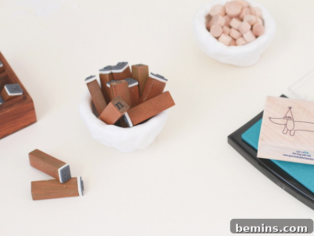 A white desk full of accessories in a 2 pots
