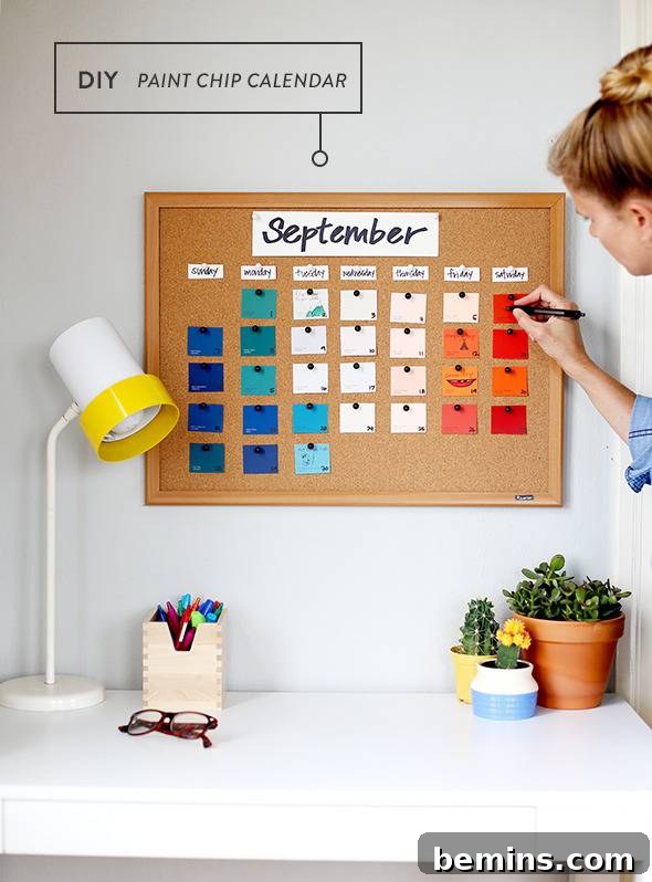 A woman is marking something on a calendar on the wall.