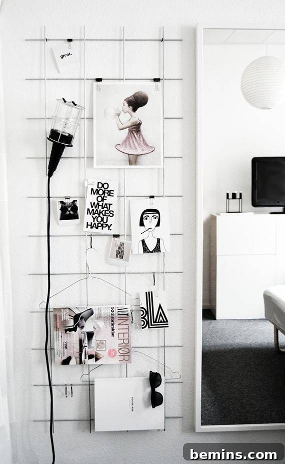 A black lamp next to several objects hanging on a wall.