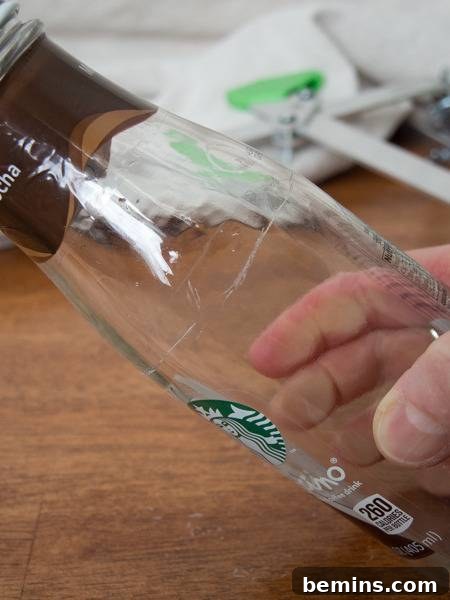 Which Bottle Cutter Reigns Supreme? A Definitive Review 13 Starbucks bottle with an uneven cut.