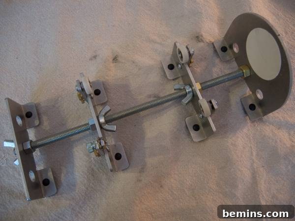 Which Bottle Cutter Reigns Supreme? A Definitive Review 21 Silver rod passing through different clamps on the Bindu.