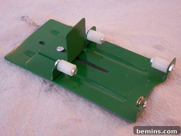 Which Bottle Cutter Reigns Supreme? A Definitive Review 28 Green bottle cutter with white knobs laying on felt.