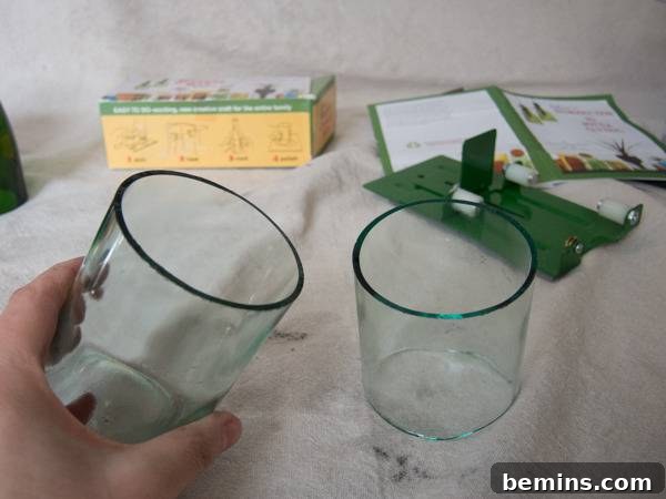 Which Bottle Cutter Reigns Supreme? A Definitive Review 31 Two pieces of a glass bottle that have been cut in half sitting on a white blanket on a table.