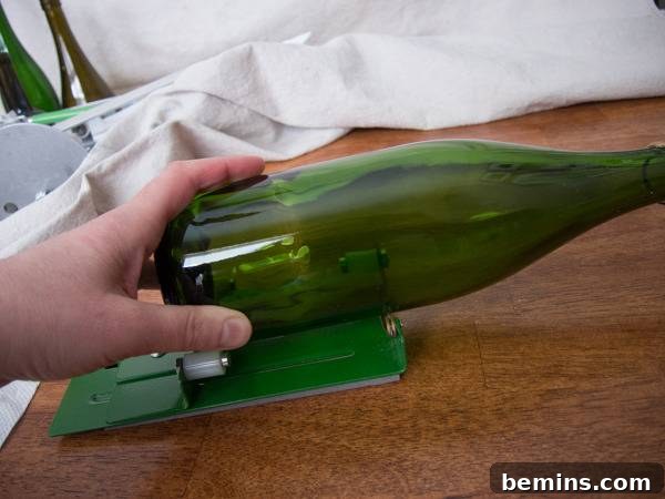 Which Bottle Cutter Reigns Supreme? A Definitive Review 32 A person cutting a green glass bottle.