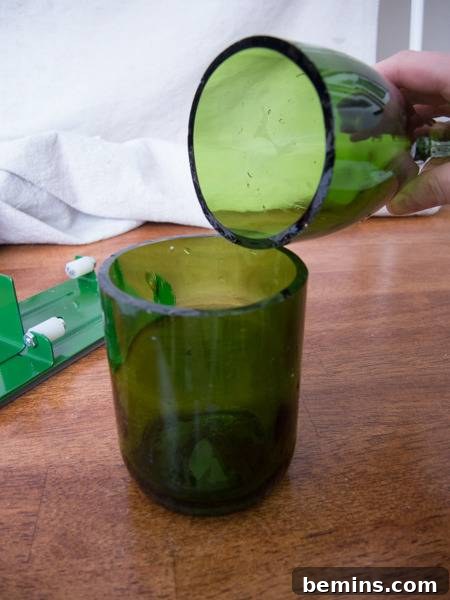Which Bottle Cutter Reigns Supreme? A Definitive Review 33 A person is pouring liquid from one green glass into another.